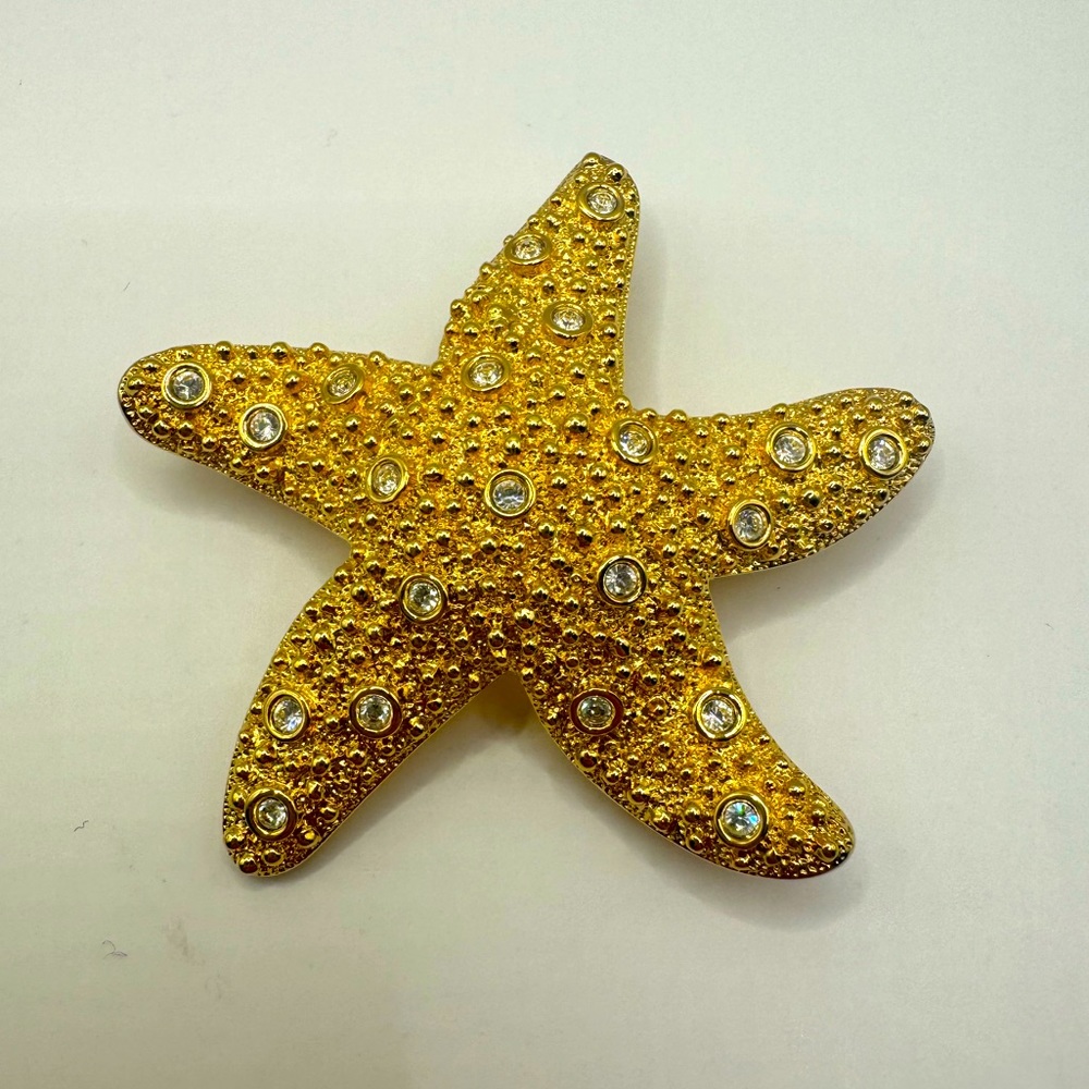 Swarovski gold & crystal starfish Brooch. Textured starfish set with crystals.